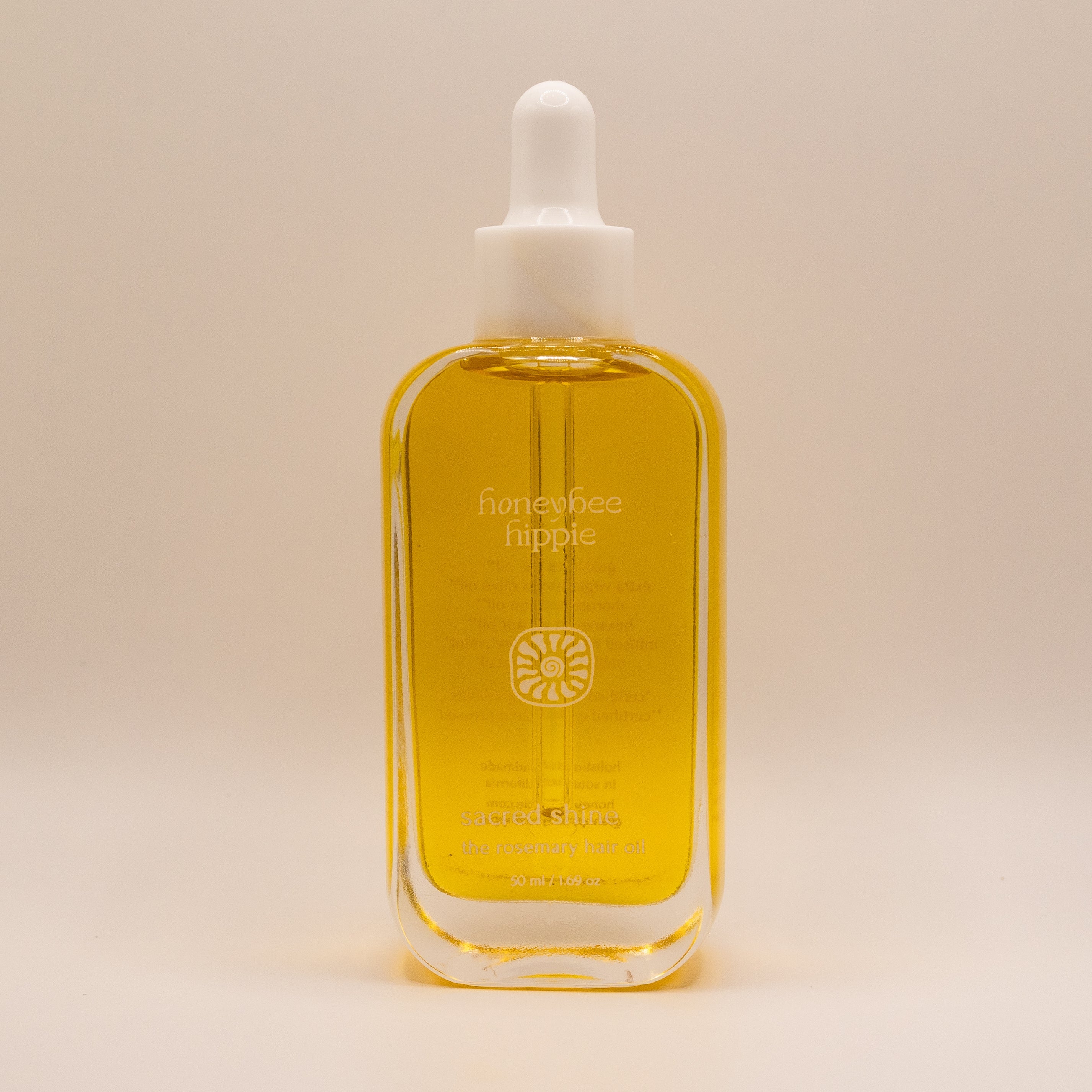 Bottle of honeybee hippie product on a beige background