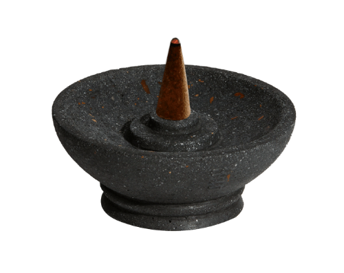 Black stone incense burner with a single incense cone on a white background