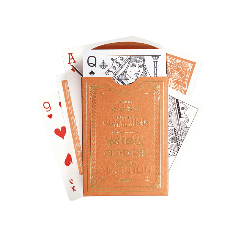 Playing cards with a decorative box labeled &