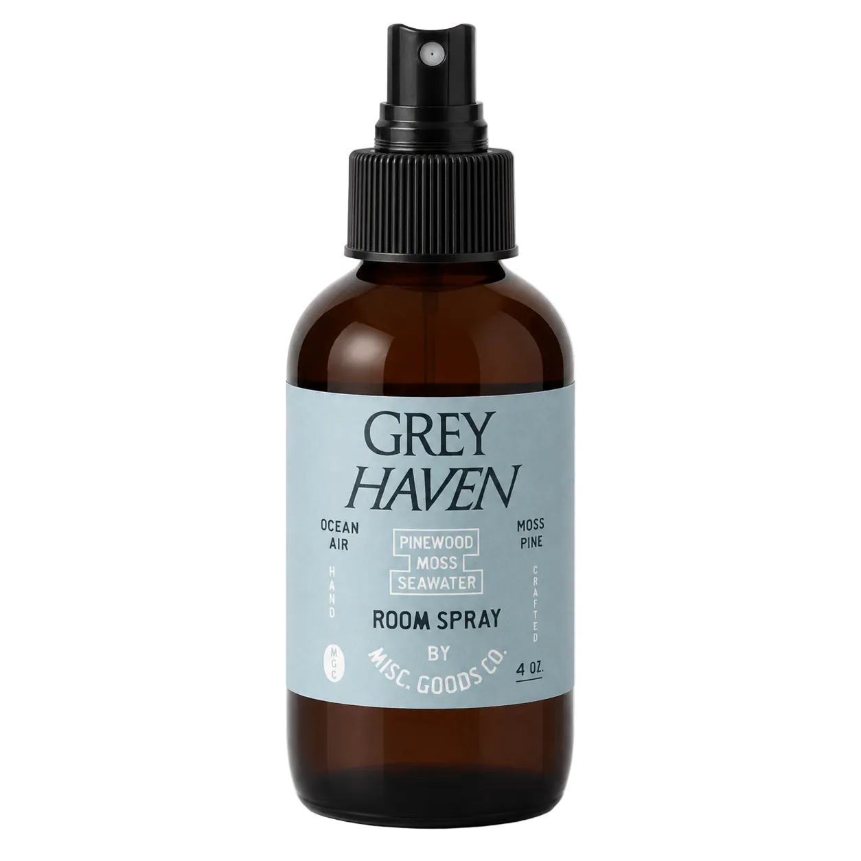 Brown spray bottle with a label for Grey Haven room spray on a white background