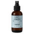 Brown spray bottle with a label for Grey Haven room spray on a white background