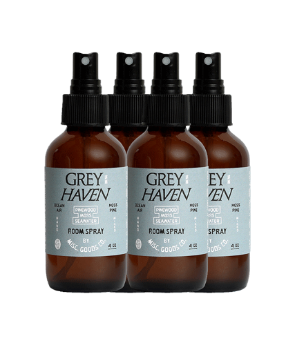 Four bottles of Grey Haven room spray on a white background