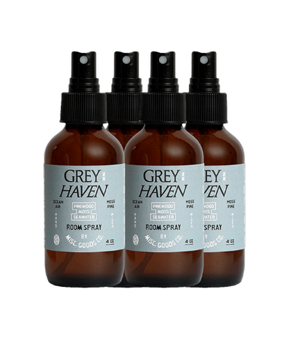 Four bottles of Grey Haven room spray on a white background