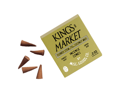 Box of Kings Market incense cones with cones scattered around on a white background