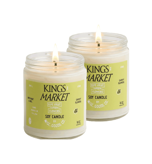 Two lit candles with &