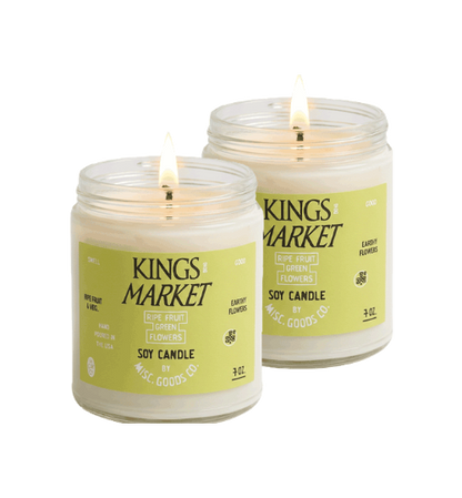 Two lit candles with &