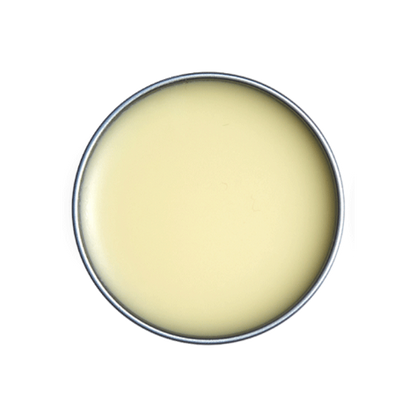 Close-up of a round container with a light yellow substance inside