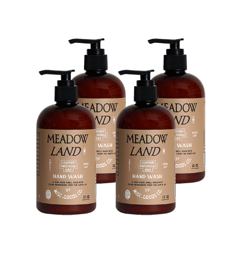 Four bottles of Meadow Land hand wash on a white background